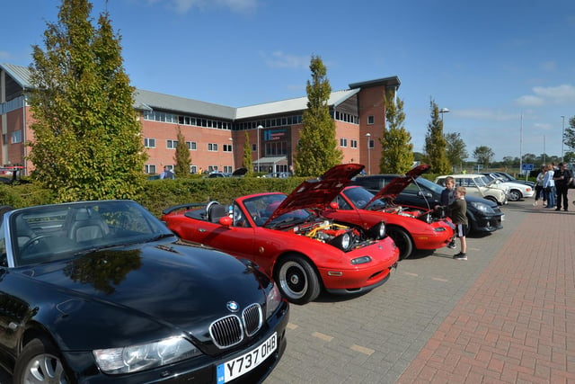 Moving on to some modern classics - here we have two red Mazda MX5s. These cars, designed in the late 80s, were inspired by the golden age of the British open-top sportscar of yesteryear. Mazda's brilliant engineers proved that fun and reliability were not mutually exclusive. In the foreground we see a pristine BMW Z3 - the one-time car of choice for James Bond.