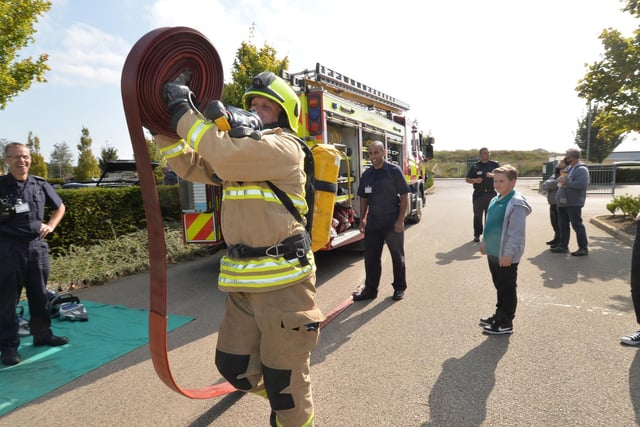 Firefighters give a demonstration of their lifesaving skills. Photo by Andrew Carpenter.