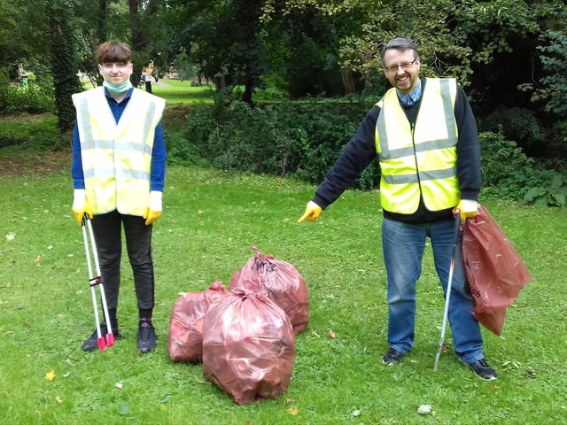 Some of the volunteers highlighting the amount of rubbish collected during the litter pick