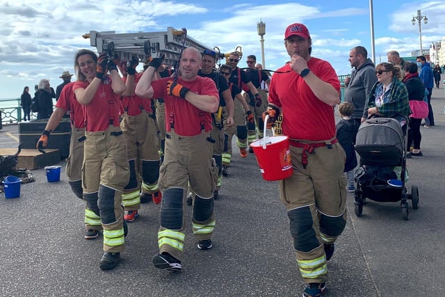 Firefighters walk from Shoreham fire station to Brighton Palace Pier to raise money for Debby Sadler who was diagnosed with pancreatic cancer. Picture: Dave Mayfield SUS-200210-155341001