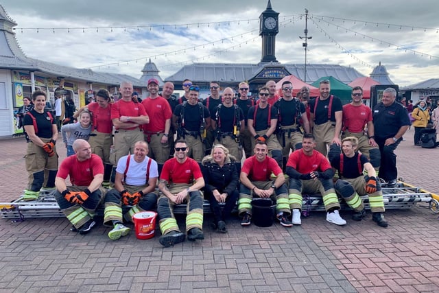 Firefighters walk from Shoreham fire station to Brighton Palace Pier to raise money for Debby Sadler who was diagnosed with pancreatic cancer. Picture: Dave Mayfield SUS-200210-155351001