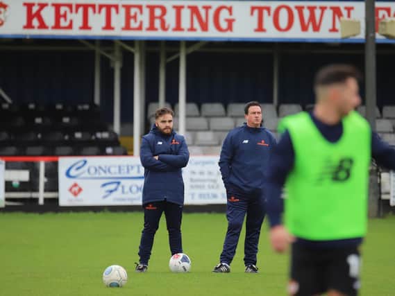Manager Paul Cox and coach Ben Marvin watch on during the warm up
