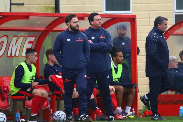 Paul Cox watches on from the touchline