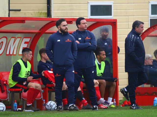Paul Cox watches on from the touchline