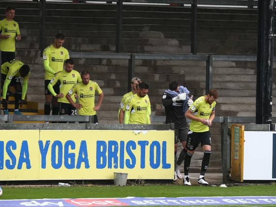 Cobblers make their way onto the pitch at the Memorial Stadium. Pictures: Pete Norton