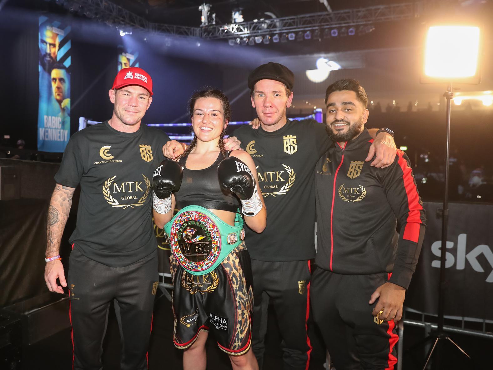 Chantelle Cameron and her team celebrate after she claimed the world title on Sunday night