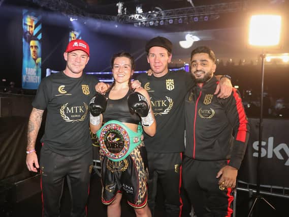 Chantelle Cameron and her team celebrate after she claimed the world title on Sunday night