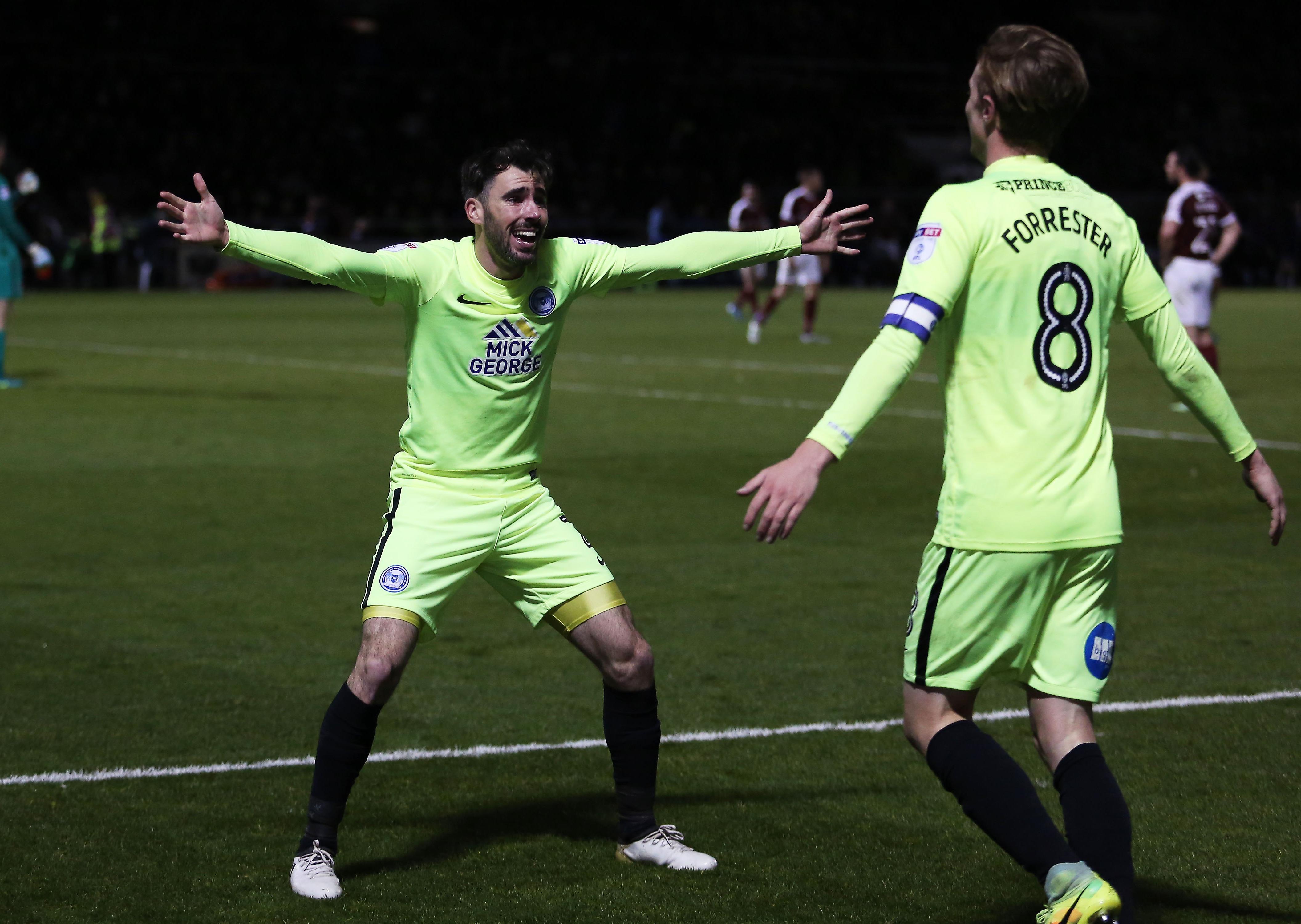 Michael Smith (left) congratulates Chris Forrester on his dramatic late winning goal for Posh at Northampton in 2016. Photo: Joe Dent/theposh.com.