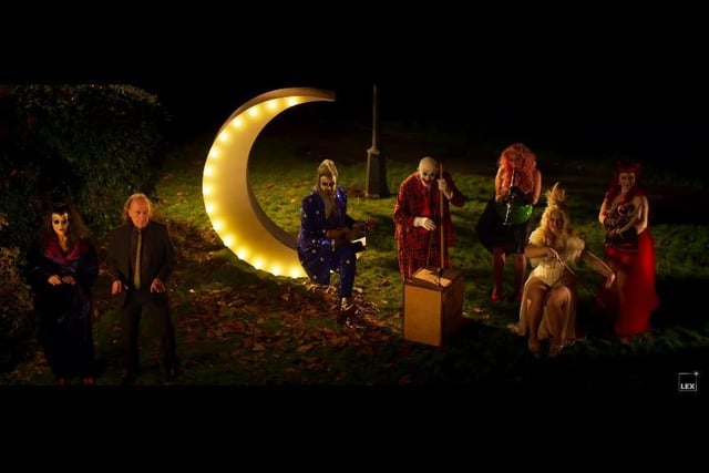 A mysterious image in the trailer show Alan Moore dressed as The Moon with a surreal band playing alongside. Then Moore's head explodes...