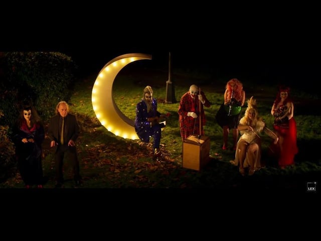 A mysterious image in the trailer show Alan Moore dressed as The Moon with a surreal band playing alongside. Then Moore's head explodes...