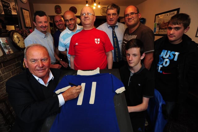 Tommy was always pleased to support charity. Here he raffles off his 1976-77 Posh shirt to raise money for the Alzheimer's Society.
