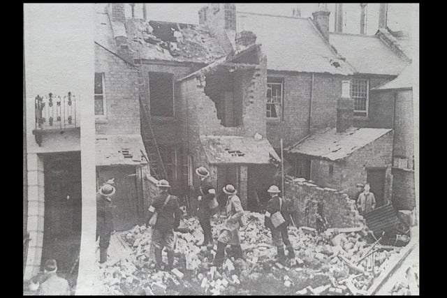 ARP wardens inspecting the damage at Ranelagh Terrace, Leamington, August 1940.