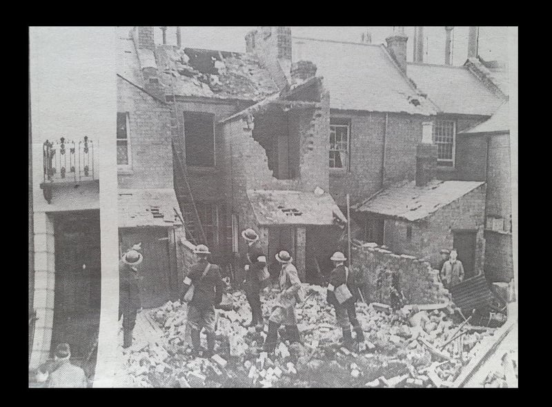 ARP wardens inspecting the damage at Ranelagh Terrace, Leamington, August 1940.