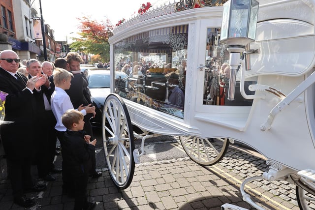 The Minter family next to the horse drawn carriage