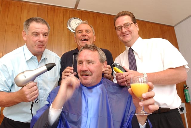 Tommy, Jack Carmichael and Chris Turner (seated) at the opening of a city barbers shop.