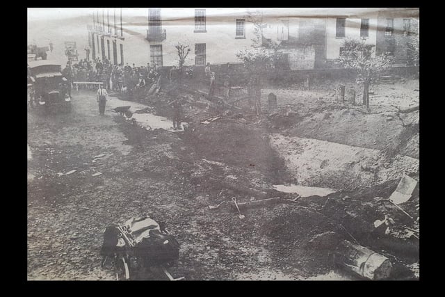A bomber crater near the parish church, Leamington, October 1940, which caused considerable damage and one fatality.