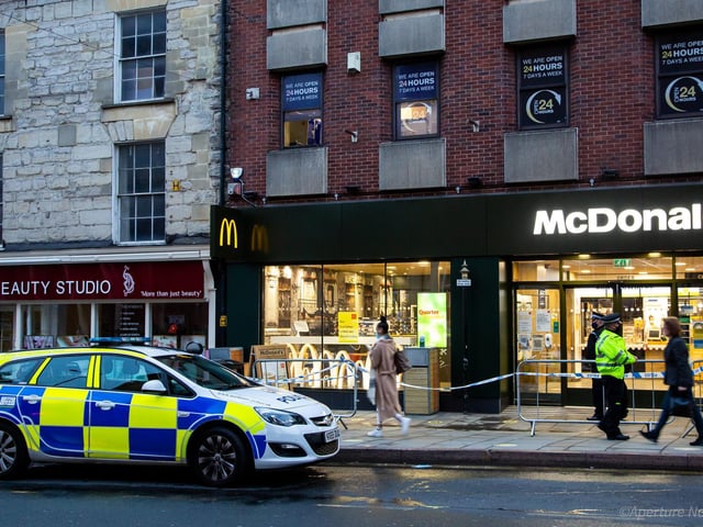 Police maintained a presence in the Drapery following the attack
