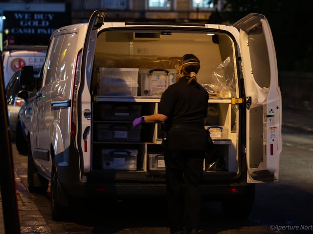 investigators load up evidence from the scene