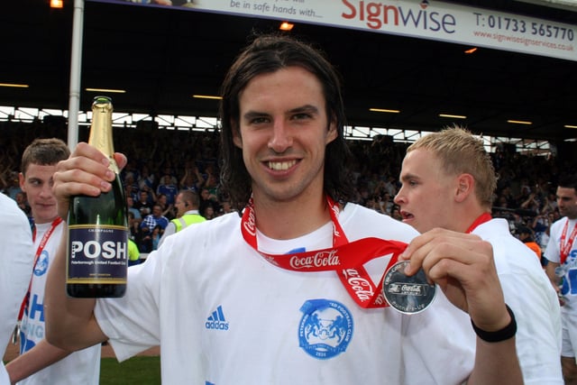 Posh were presented with League One promotion medals in May, 2009. Here George proudly shows his off to the camera.