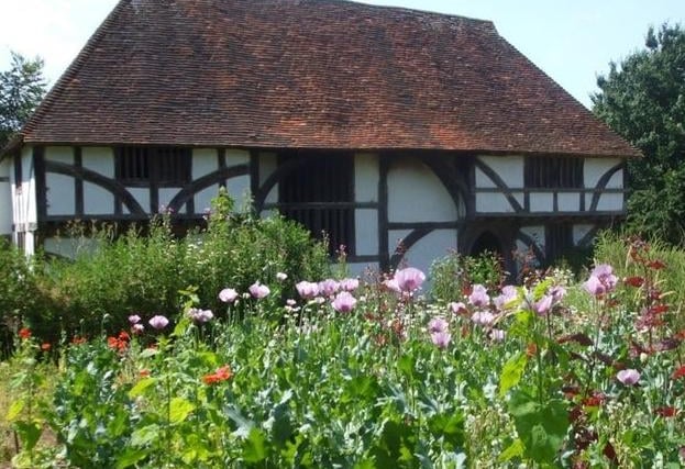 Weald and Downland Living Museum, Singleton: many of the old buildings are said to have ghosts. Shadowy figures have been seen hanging around a medieval shop and a woman in a long dress has been spotted walking from house to house.