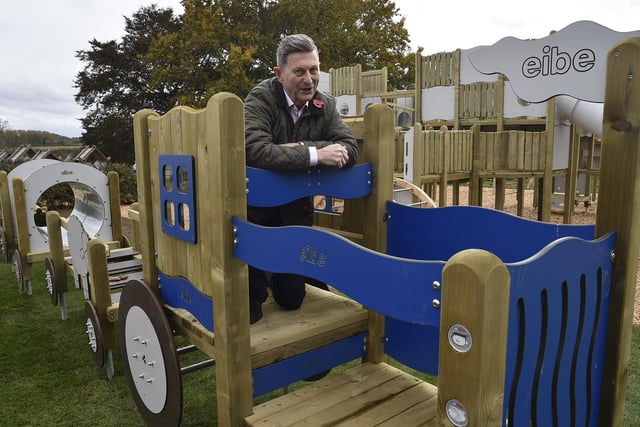 Opening the new play area at Sacrewell Farm , Cllr Steve Allen looking at play equipment. EMN-201023-175730009