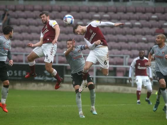 Fraser Horsfall wins a header. Pictures: Pete Norton