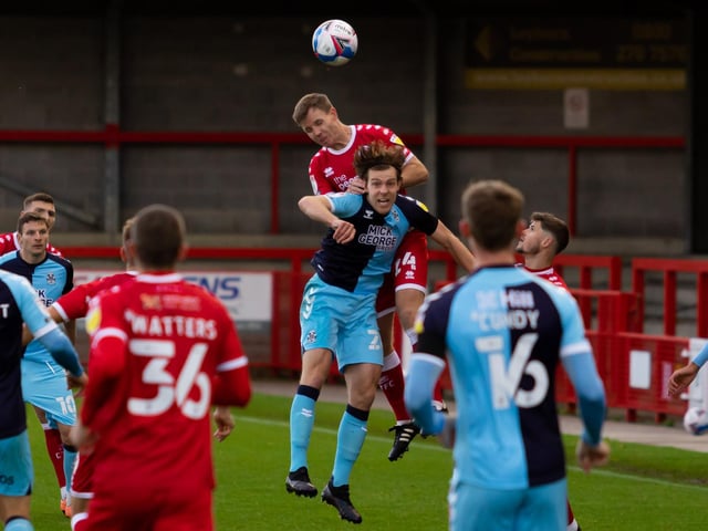 Tony Craig wins a header