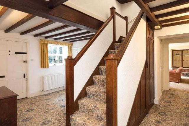 The farmhouse is approached by the spacious entrance hall with stairs leading to the first floor.