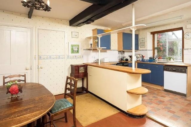 This kitchen/breakfast room comes with its own pantries.