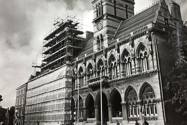Scaffholding goes up round the Guildhall so that grime built up over many years could be washed away from the stonework. ©️ Chronicle & Echo