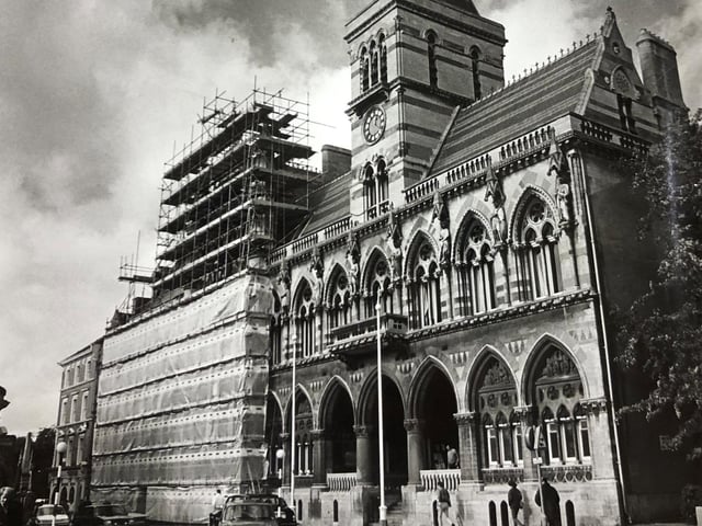 Scaffholding goes up round the Guildhall so that grime built up over many years could be washed away from the stonework. ©️ Chronicle & Echo
