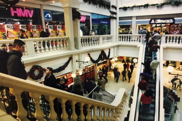 Shoppers doing some Christmas buying inside The Grosvenor Centre back in the `nineties. Do you remember Littlewoods. ©️ Chronicle & Echo.