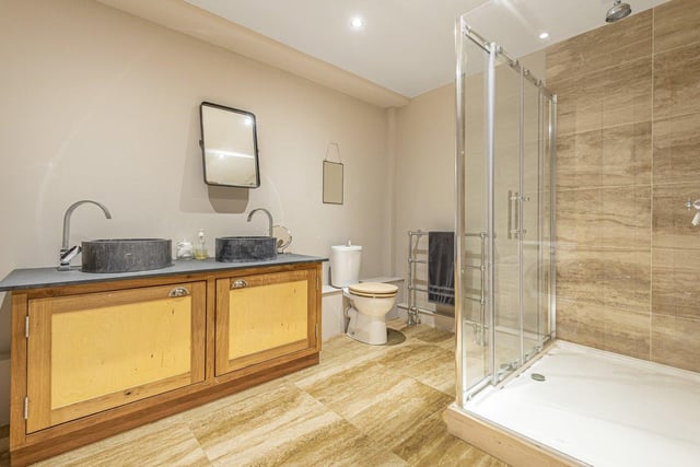 From the kitchen you enter a bedroom and adjacent to this a large family bathroom, with all modern fixture and fittings, installed to a very high specification.