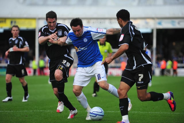 August 2011, Posh 7. Ipswich 1. Championship. A stunning win secured by Tomlin's hat-trick, two goals for Paul Taylor and two for McCann. Ipswich had two players sent off. Tomlin is pictured in action during that game.
