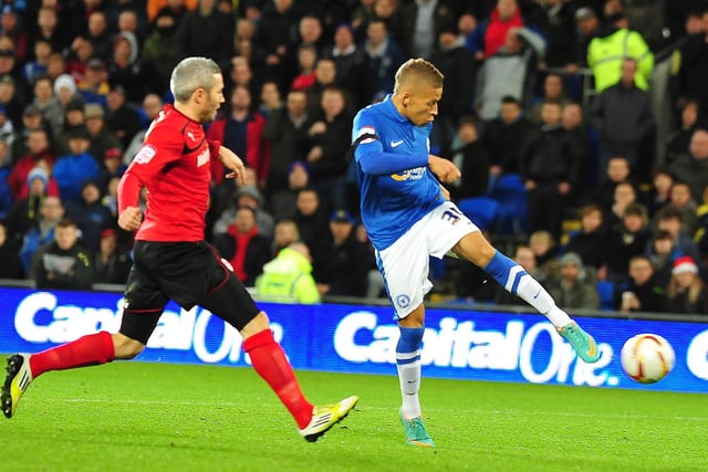December 2012, Cardiff 1, Posh 2, 2012, Championship. The first signs that Posh were going to make a decent fist of a survival battle as goals from Michael Bostwick and newcomer Dwight Gayle secured a win at the team who would go to win the league. Gayle is pictured scoring his goal.
