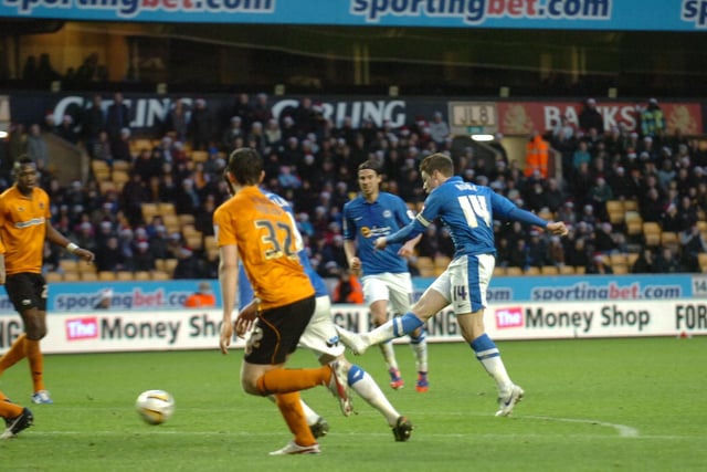December, 2012, Wolves 0, Posh 3, Championship. Posh were brilliant on Boxing Day and won at Molineux with goals from Tomlin, Rowe and Gayle. Rowe is pictured scoring his goal. Loanee George Thorne was superb in midfield, but was forced to return to West Brom after the game and never played for Posh again.