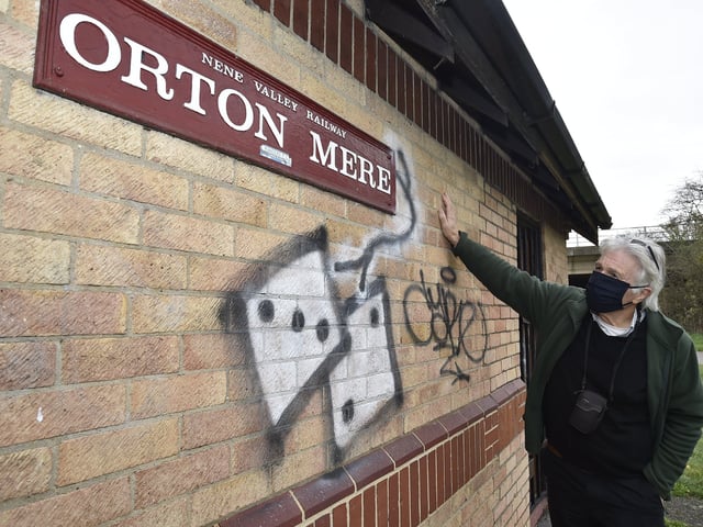 Orton Mere station  Brian Pearce from Railworld looking over graffiti on the station building and trackside. EMN-201116-141925009