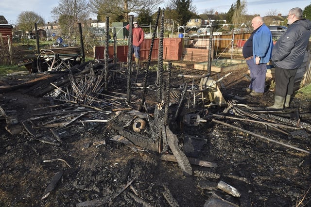 Fane Road allotment holders looking at the damage caused after fires destroyed several sheds while others were broken into.
