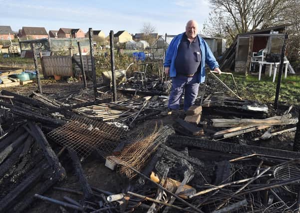 Association chairman Bob Morton joined Fane Road allotment holders to look at the damage caused after fires destroyed several sheds while others were broken into. Pictures David Lowndes.