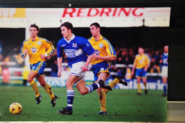 ADAM DRURY: Posh years 1996-2001, Posh apps: 176. Unarguably the greatest left-back in Posh history. One-on-one he was virtually impossible to get past and his quality on the ball improved with experience. Drury helped Posh win promotion from the old Division Three through the play-offs in the 1999-2000 season and some eye-catching displays the following season caught the attention of some bigger clubs. Norwich City took him for a fee of £500k and he was soon skippering the side to promotion to the Premier League. Drury spent 11 years at Carrow Road and made over 350 appearances for the club. Later in his career he was hampered by a persistent knee injury and short spells at Leeds and Bradford City followed before retirement. Drury was a Posh Academy graduate and now coaches a young Canaries team while helping out on first-team match days at Carrow Road.