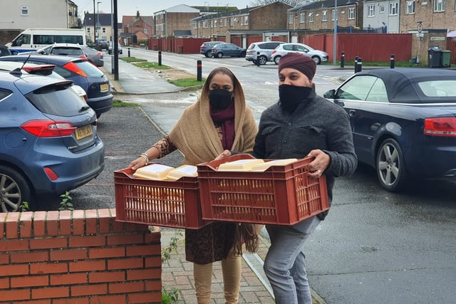 Harprobhjot Singh and wife Sheila Kaur making a delivery to YMCA on Wellington Street