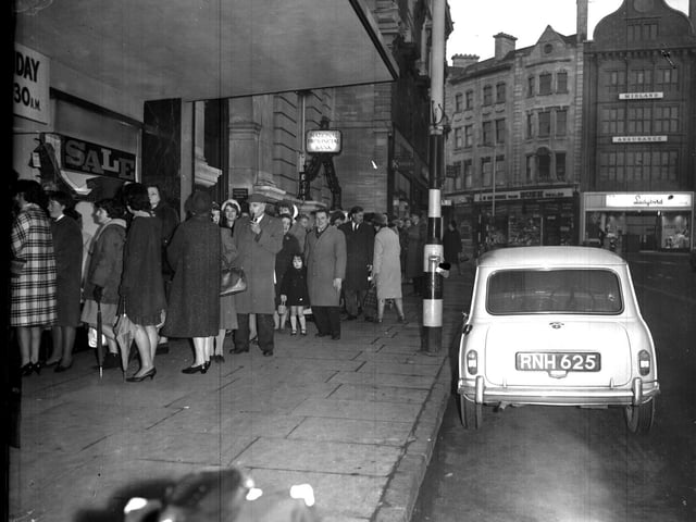 Shoppers queue up around the block on the Drapery for the New Year Day sales on January 1, 1965.