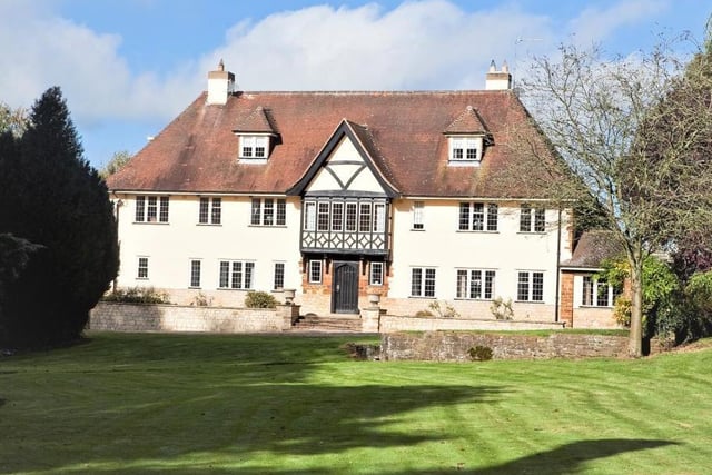 This eight-bedroom country house in Towcester has an adjoining annexe, separate detached cottage, outbuildings and paddocks as well as a swimming pool and tennis court! It is set in 10.5 acres.