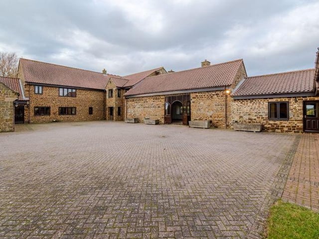 This five bedroom farm house on Back Lane in Hardingstone consists of over 11,000 square feet of accommodation. It boasts of a huge indoor swimming pool area, changing rooms, a hot tub, a sauna, two triple garages and a party room complete with a bar!