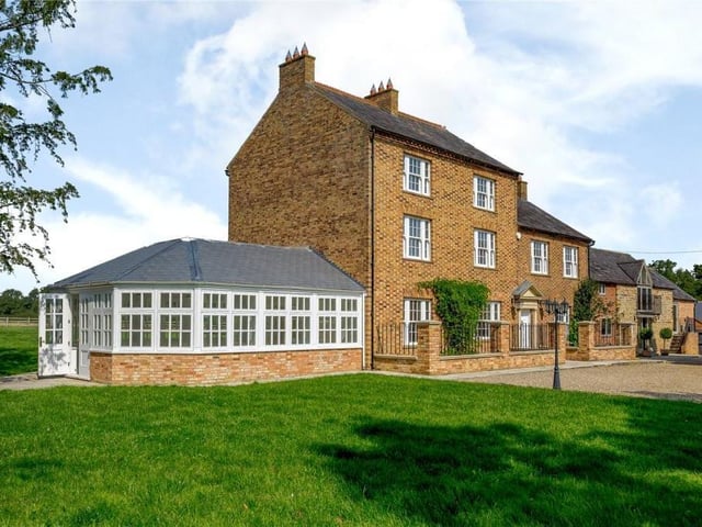 Hardwick Lodge has six bedrooms and six bathrooms - quirks include an office, a library, an orchard and an outbuilding as well as 1.45 acres of land.