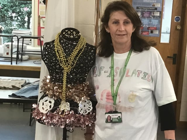 KSHS Head of Year 7 Julie Pankhurst with the Year 7 Christmas T-shirt design - Elf Isolation. EMN-201112-175809001
