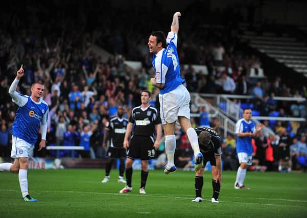 Lee Tomlin celebrates a hat-trick for Posh against Ipswich in 2011.