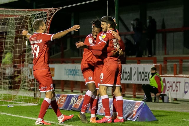 Crawley players celebrate the fourth goal