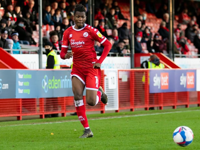 Fans watch on as David Sesay races down the wing