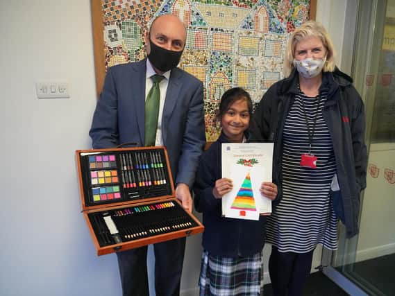 Khadija with Andrew Griffith and her art teacher